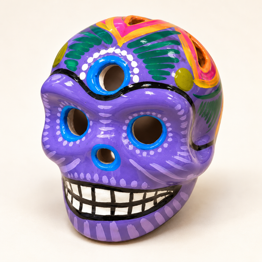Medium Purple hand-painted ceramic sugar skull, approximately 2.5–3 inches, front view with decorative cutouts.