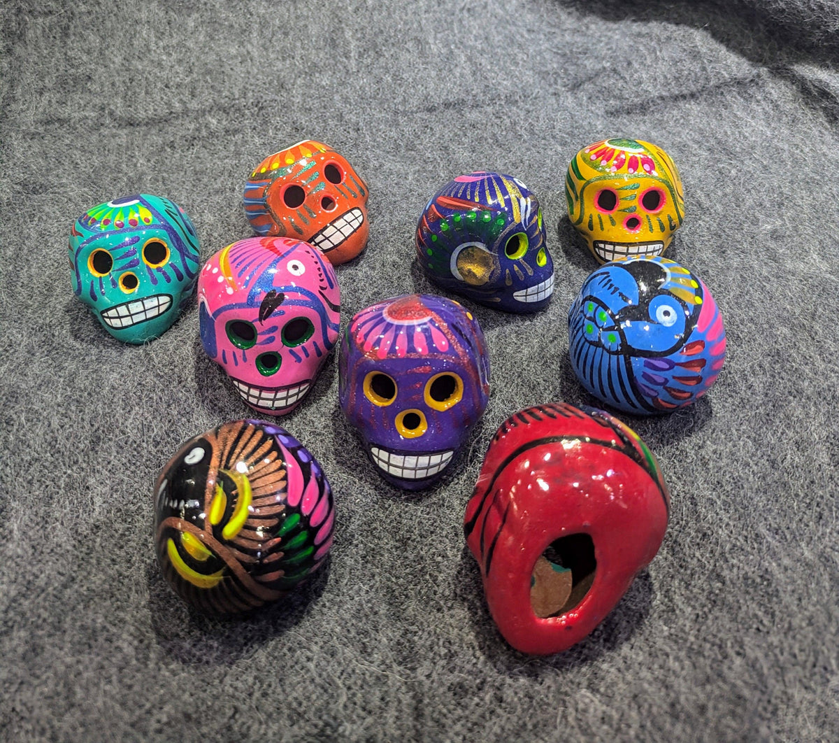 Small hand-painted terra cotta sugar skull, glossy Mexican ceramic design, product view 2