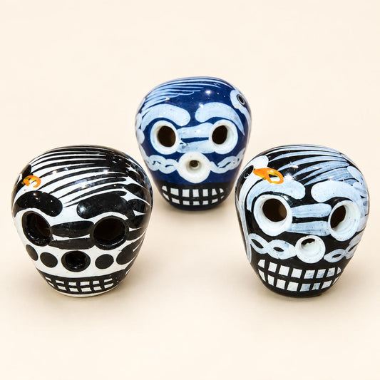 XSM ceramic sugar skulls in dark blue, white and black, approximately 1 inch