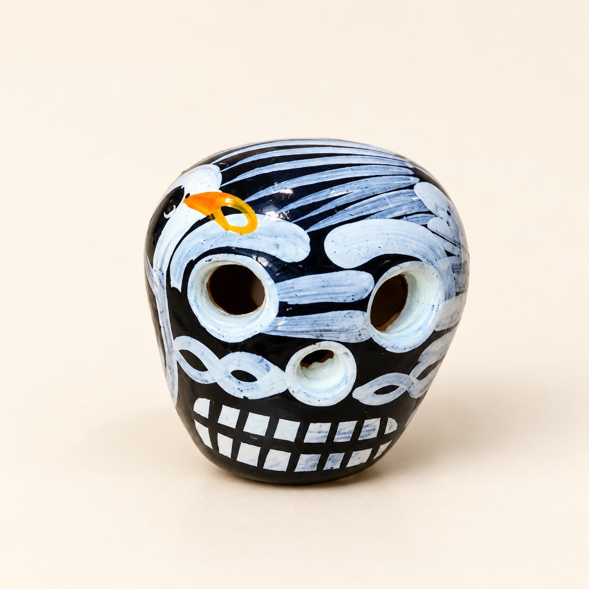 Black XSM hand-painted ceramic sugar skull, approximately 1 inch, made in Mexico