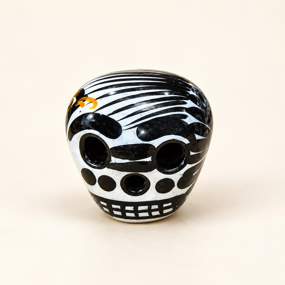 White XSM hand-painted ceramic sugar skull, approximately 1 inch, made in Mexico